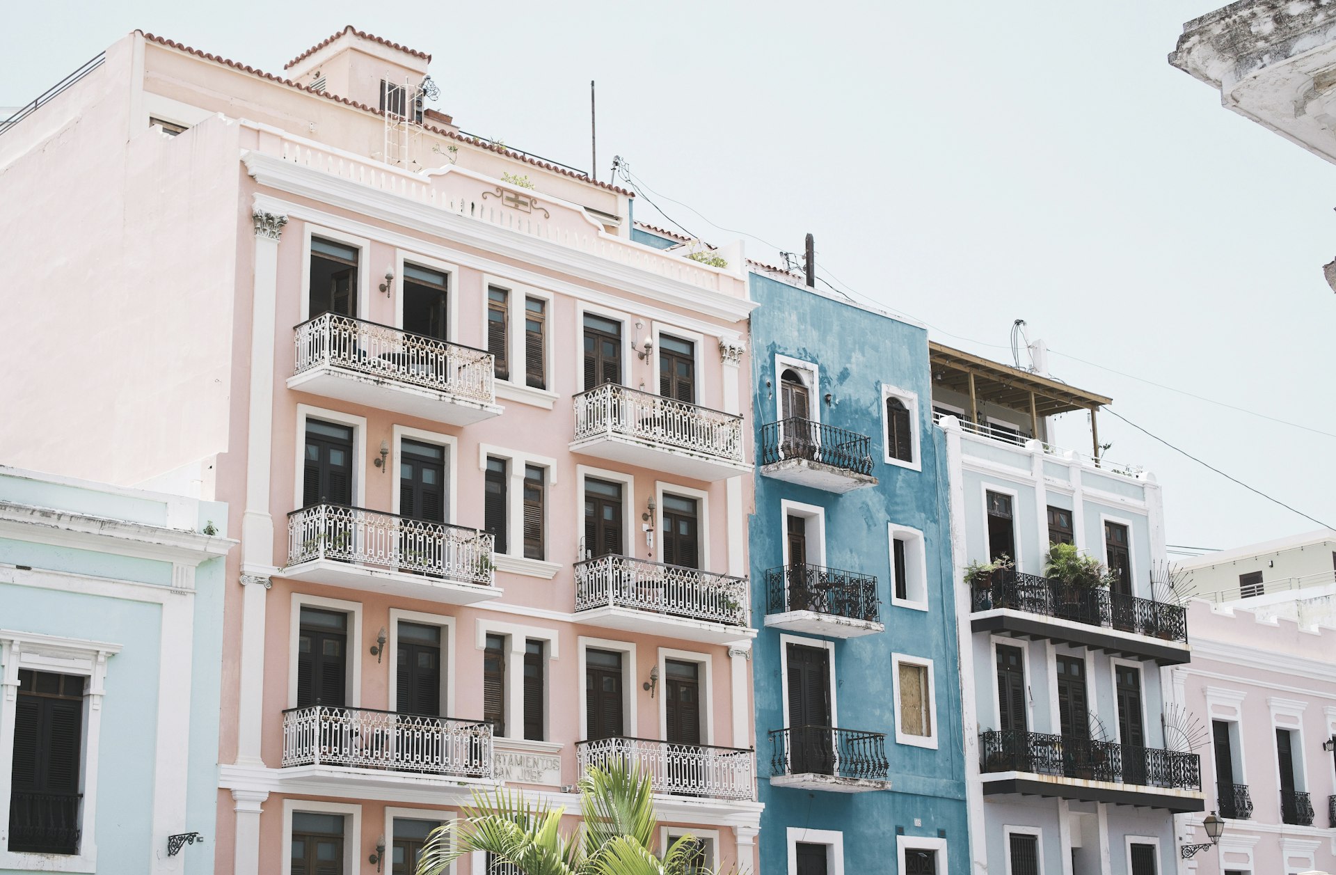 photo of blue and pink painted high-rise building